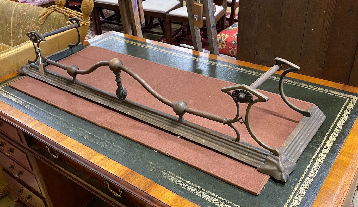 An Edwardian brass fire kerb, length 133cm